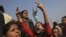 Demonstrators shout slogans near the presidential palace during a protest in New Delhi, Dec. 22, 2012. 