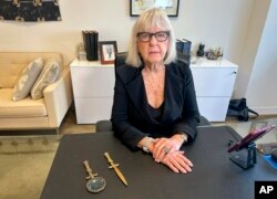 Harriet Newman Cohen, 91, poses in her law office in Times Square, New York, on July 18, 2024. She says she still works 