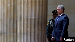 Colombian President Ivan Duque awaits the arrival of Spain's Prime Minister Pedro Sanchez at an official ceremony at the presidential palace in Bogota, Colombia, Aug. 30, 2018. 