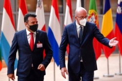 FILE - European Council President Charles Michel, right, speaks with North Macedonia Prime Minister Zoran Zaev prior to a meeting at the European Council building in Brussels, May 19, 2021.