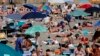 Sunbathers crowd the Ostia beach west of Rome on June 8, 2014.