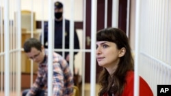 Belarusian journalist Katsiaryna Barysevich, right, and Dr. Artom Sorokin attend a court hearing in Minsk, Belarus, Feb. 19, 2021.