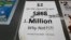 An updated paper sign is displayed the counter of a 7-Eleven store shows that the Mega Millions estimated jackpot has soared to $1 billion Oct. 19, 2018, in Chicago. No one won Friday, and the jackpot is estimated to be $1.6 billion by Tuesday's drawing.