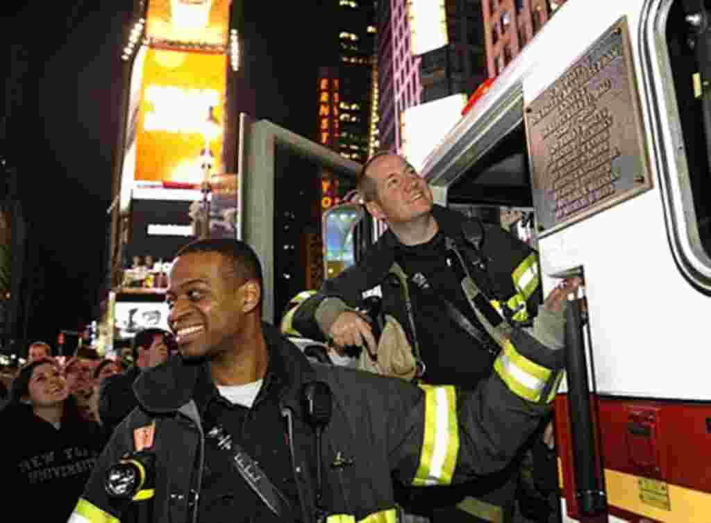 New York City firefighters gather in Times Square New York May 2, 2011 shortly after the announcement from the President Obama announced that Al-Qaida mastermind Osama bin Laden was dead and the United States has his body, May 2, 2011.