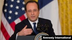 French President François Hollande speaks during a joint news conference with President Barack Obama, in the East Room of the White House in Washington, D.C., Feb. 11, 2014.