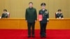 Chinese President Xi Jinping stands with Chen Hui, who was named political commissar of the army and promoted to the rank of senior general, at a ceremony in Beijing, Dec. 23, 2024. (Xinhua via AP)