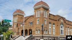 Visitors look at the 16th Street Baptist Church in Birmingham, Ala., July 29, 2016. The church was the scene of a Ku Klux Klan bombing that killed four black girls in 1963.