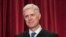 Associate Justice Neil Gorsuch joins other justices of the U.S. Supreme Court for an official group portrait at the Supreme Court Building in Washington. June 1, 2017. 
