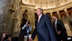 Speaker of the House John Boehner, R-Ohio, walks to the House floor for a vote on the continuing resolution, at the Capitol in Washington, Monday night, Sept. 30, 2013.