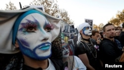 Members and supporters of the lesbian, gay, bisexual and transgender (LGBT) community protest against discrimination and violence, at the Place de la Republique in Paris, France, Oct. 21, 2018. 