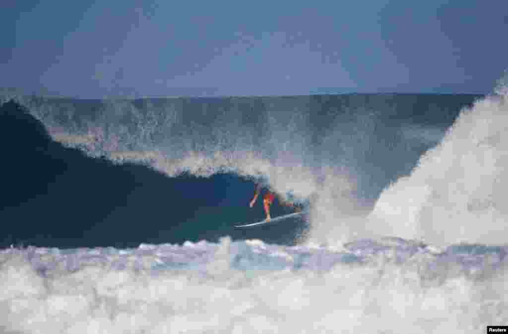 Surfer Joel Parkinson competes during the Billabong Pipe Masters at the Banzai Pipeline in Pupukea on the island of Oahu, Hawaii, U.S.