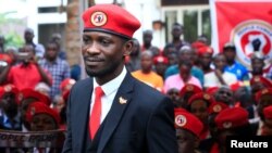 FILE - Ugandan musician turned politician, Robert Kyagulanyi, also known as Bobi Wine, arrives at the news conference at his home in Kasangati, Kampala, Uganda, July 24, 2019.