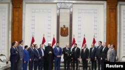 نزار امدی، رییس‌ جمهوری عراق، و علی الزیدی، نامزد نخست‌وزیری عراق، در مراسمی در بغداد (سه‌شنبه ۸ اردیبهشت ۱۴۰۵)