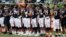 The Chicago Bears lock arms during the National Anthem in the first half of an NFL preseason football game against the Cincinnati Bengals, Aug. 9, 2018, in Cincinnati. 