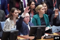 FILE - Russian representative to the the United Nations Vassily Nebenzia votes on a resolution regarding the situation in Israel and Gaza at a Security Council meeting on the situation in the Middle East, at the United Nations on October 18, 2023 in New York.