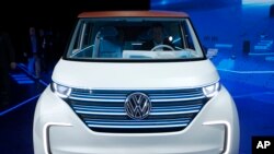 Volkswagen unveils the BUDD-e electric and connected car during a keynote address at CES International, Jan. 5, 2016, in Las Vegas.