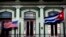 FILE - A Jan. 19, 2015, photo shows the Cuban and U.S. flags waving from the balcony of the Hotel Saratoga in Havana.