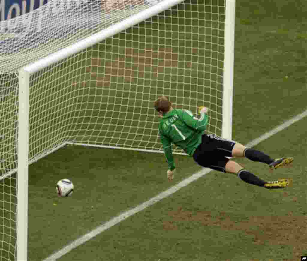 Germany goalkeeper Manuel Neuer looks at the ball that hit the bar to bounce over the line during the World Cup round of 16 soccer match between Germany and England at Free State Stadium in Bloemfontein, South Africa, Sunday, June 27, 2010. (AP Photo/Ales