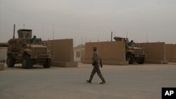 In this Nov. 8, 2017 photo, U.S. Marines are stationed in al-Asad air base in Anbar, Iraq. The U.S.-led coalition's outpost in the fight against the Islamic State is in the corner of western Iraq near the border with Syria where American Marines operate close to the battlefront.