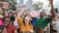 Therese Gachnauer, center, a 18 year old senior from Chiles High School and Kwane Gatlin, right, a 19 year old senior from Lincoln High School, both in Tallahassee, join fellow students protesting gun violence on the steps of the old Florida Capitol in Ta
