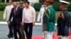 Philippine President Rodrigo Duterte and Malaysian Prime Minister Mahathir Bin Mohamad walk together during the welcoming ceremony for the Malaysian leader at the Malacanang presidential palace in Manila, Philippines, March 7, 2019. 