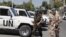 Members of the United Nations observers mission in Syria, who have left their bases in the province of Homs in Central Syria, return to their hotel in Damascus on August 20, 2012.