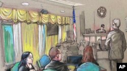 FILE - An April 15, 2019 court sketch shows Yujing Zhang (L), a Chinese woman charged with lying to illegally enter President Donald Trump's Mar-a-Lago club, listening to a hearing in West Palm Beach, Fla. 