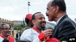 Ethiopia's Prime Minister Abiy Ahmed (C) welcomes Eritrea's President Isaias Afwerki upon his arrival at the airport in Gondar, for a visit in Ethiopia, on Nov. 9, 2018.