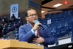 Navajo Nation President Buu Nygren addresses a crowd at an indoor sports arena, Tuesday, Jan. 10, 2023, in Fort Defiance, Ariz. (AP Photo/Felicia Fonseca)