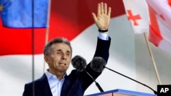 FILE - Billionaire Bidzina Ivanishvili, founder of the Georgian Dream party, greets demonstrators in Tbilisi, Georgia, on April 29, 2024.