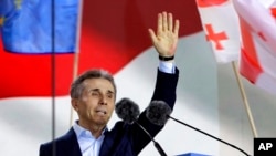 FILE - Billionaire Bidzina Ivanishvili, founder of the Georgian Dream party, greets demonstrators in Tbilisi, Georgia, on April 29, 2024.