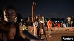 Supporters of Felix Tshisekedi, leader of the Congolese main opposition party, the Union for Democracy and Social Progress (UDPS) celebrate after the judges of the Constitutional Court confirmed Tshisekedi's victory, Jan. 20, 2019.