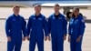 FILE - The SpaceX crew, from left, cosmonaut Alexander Grebenkin, pilot Michael Barratt, commander Matthew Dominick and mission specialist Jeanette Epps pose after arriving at the Kennedy Space Center in Cape Canaveral, Florida, Feb. 25, 2024.