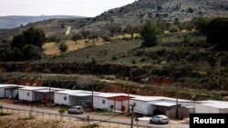 FILE - Mobile homes sit in the Jewish settlement of Givat Haroeh in the Israeli-occupied West Bank, Feb. 21, 2023. European Union envoy Sven Koopmans says Israeli settlements and violence in the West Bank are impediments to a peaceful two-state solution in the Middle East.