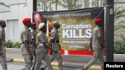 Security personnel arrive at the first annual summit of the newly launched anti-corruption group "Buharian Culture Organization" in Abuja, Nigeria.