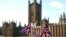 British Union flags fly in front of The Houses of Parliament in London, Jan. 22, 2019. British Prime Minister Theresa May launched a mission to resuscitate her rejected European Union Brexit divorce deal, setting out plans to get it approved by Parliament.
