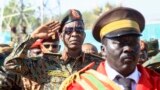 Deputy head of Sudan's ruling Transitional Military Council (TMC) Shams al-Din Kabashi (L) attends a graduation ceremony of fighters Sudan Liberation Movement, a Sudanese rebel group active in Sudan's Darfur State which supports army chief Abdel Fattah al