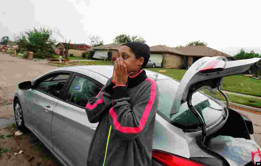 Menique Waites looks at her home which was destroyed by a tornado in Lancaster, Texas. (Reuters)