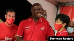 Trinidad and Tobago Prime Minister Keith Rowley reacts while claiming victory for his ruling party in a general election in Port of Spain, Aug. 11, 2020.