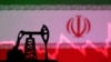 Bendera Iran, grafik saham, dan miniatur pompa angguk minyak dalam ilustrasi ini, 9 Oktober 2023. (Foto: REUTERS/Dado Ruvic)