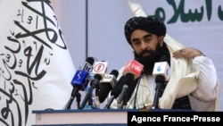 FILE - Taliban chief spokesman Zabihullah Mujahid speaks during an event in Kabul, Afghanistan, Nov. 25, 2021. 