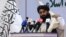 FILE - Taliban chief spokesman Zabihullah Mujahid speaks during an event in Kabul, Afghanistan, Nov. 25, 2021. 