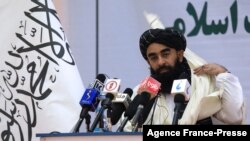 FILE - Taliban chief spokesman Zabihullah Mujahid speaks during an event in Kabul, Afghanistan, Nov. 25, 2021. 