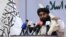 FILE - Taliban chief spokesman Zabihullah Mujahid speaks during an event in Kabul, Afghanistan, Nov. 25, 2021. 