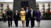 U.S. Republican Presidential candidate Mitt Romney and his wife Ann walk with dignitaries as they visit the monument to the Ghetto Heroes in Warsaw, July 31, 2012. 