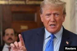 Former U.S. President Donald Trump speaks outside the court room at a Manhattan courthouse, during the trial of himself, his adult sons, the Trump Organization and others in a civil fraud case brought by state Attorney General Letitia James, in New York City, October 2, 2023.