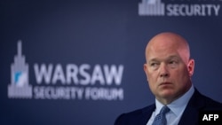 Посол США при НАТО Мэттью Уитакер на Варшавском форуме по безопасности.  (Photo by Wojtek RADWANSKI / AFP)