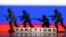 FILE PHOTO: Illustration shows plastic letters arranged to read "Sanctions" and solider toys are placed in front of Russia's flag colors