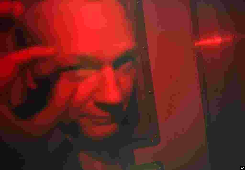 Assange being driven away from Westminster Magistrates Court in a police van, in London December 14, 2010.  (/Paul Hackett/Reuters)