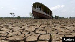 A boat lies on the bottom of Amazonas river, in the city of Manaus, Brazil, Oct. 26, 2015.